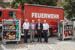 Landesfeuerwehrkommandant Reinhard Leichtfried, LH-Stv. Anton Lang, LH Christopher Drexler und Landesfeuerwehrkommandant-Stellvertreter Christian Leitgeb (v.l.) vor einem KHD-LKW mit Rollcontainern. © Land Steiermark/ Binder